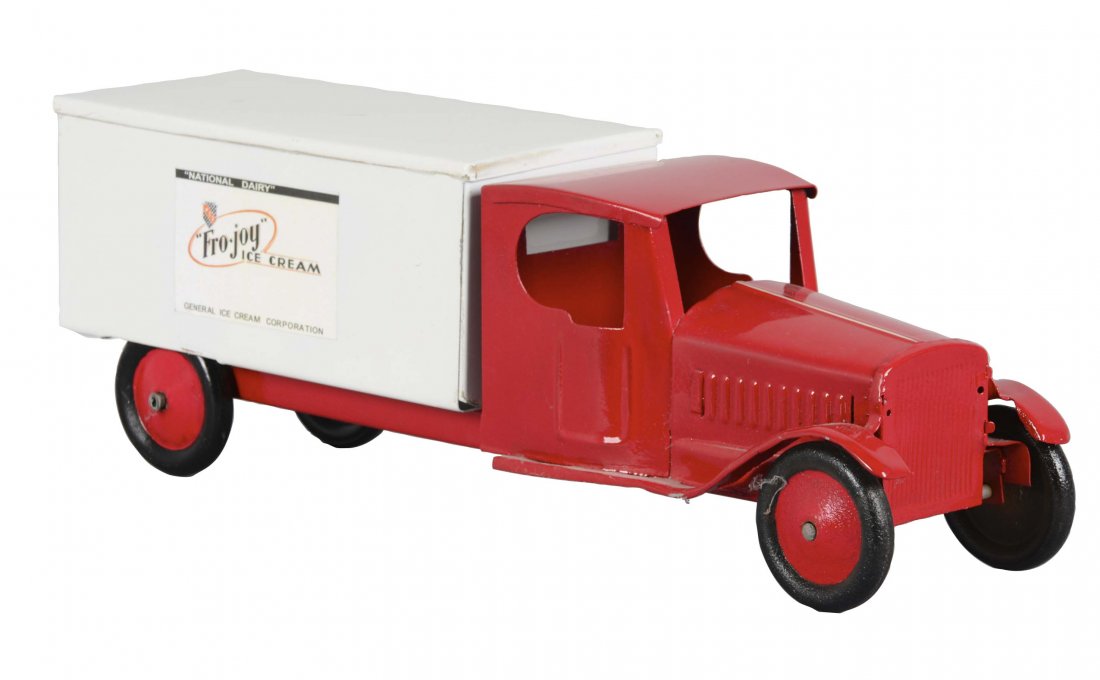 Pressed Steel Fro-Joy Ice Cream Truck: This pressed steel truck features advertising for Fro-Joy Ice Cream and has undergone a full restoration. (Excellent). 22" L.