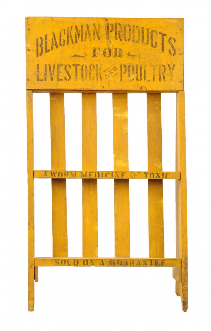 Blackman Products Livestock Display Rack.: This is a nice early stenciled livestock and poultry medicine display rack. There is stenciling in five sections. Has some soiling and weathering but displays well. (Very Good). 30" T.