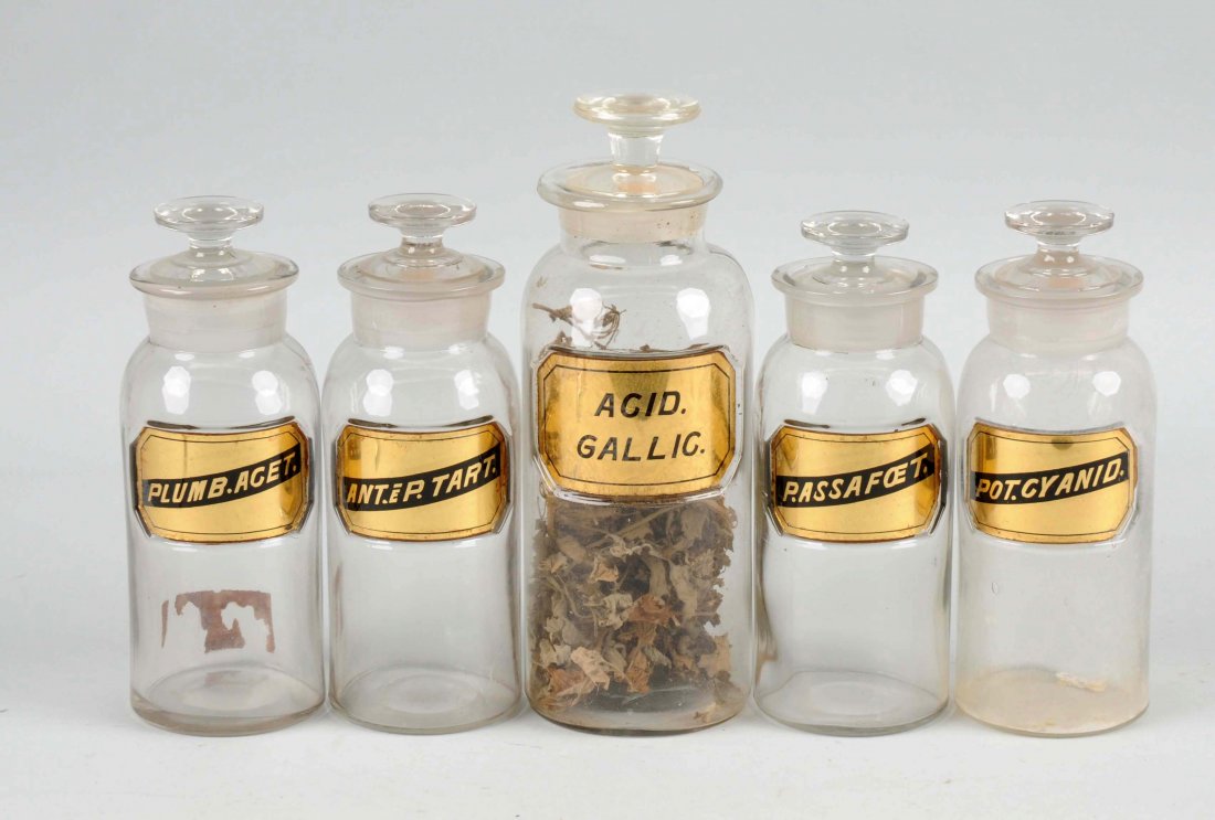 Lot of 5: Early Apothecary Glass Jugs.: All the jars have ground necks and reverse glass labels. Some of the titles on the jars are: Acid Gallic, Plumb.Acet. Ant.EP.Tart., P.Assafoet., and Pot.Cyanid. All are in very good condition with lig