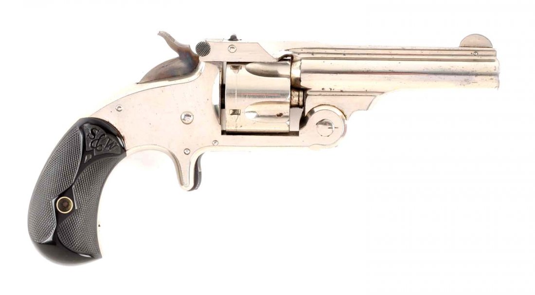 (A) Boxed S&W .32 Single Action Revolver.: Manufacturer: Smith & Wesson Serial No. 21403 Caliber: .32 S&W centerfire Barrel Length: 3” FFL Status: Antique This is a late model manufactured 1878 to 1892. This is a top break, five shot, single