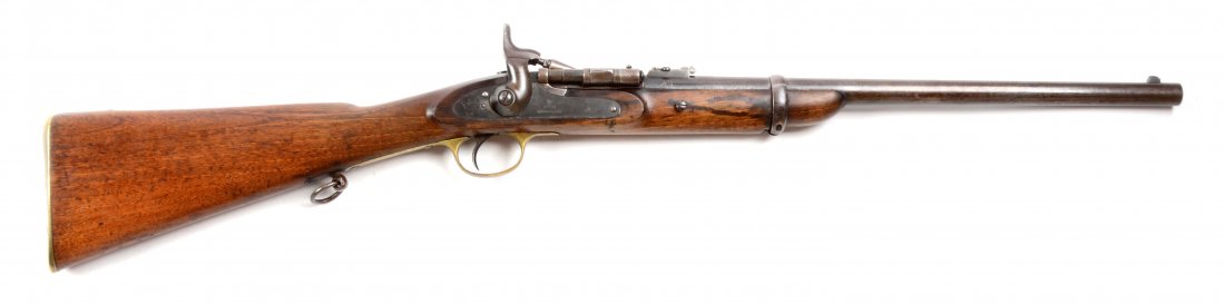 (A) Enfield MK III 1870 Snider Carbine.: Manufacturer: Enfield Model: Carbine Caliber: 60.000 Barrel Length: 19 - 1/4” FFL Status: Antique Round barrel with steel barrel band and adjustable rear sight. Marked at breech, on left side “STE