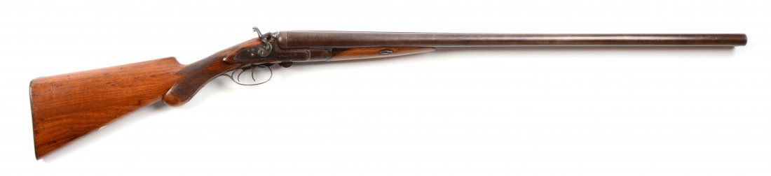 (C) W. Moore & Co. 10 Bore Double Barrel Shotgun.: Manufacturer: W. Moore & Co Model: DB Barrel Length: 32” FFL Status: Curio & Relic Gauge: 10 Round Damascus steel barrels with solid concave rib and single silver bead. Rib marked “LONDON LAMINATE