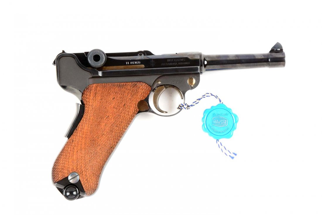 (M) NIB Mauser American Eagle Luger Imported By: Manufacturer: Mauser Model: P08 Serial No. 11.013026 Caliber: 9mm Barrel Length: 3” FFL Status: Modern Blue finish with strawed accents and blued gripstrap safety. American Eagle engraved on breech 