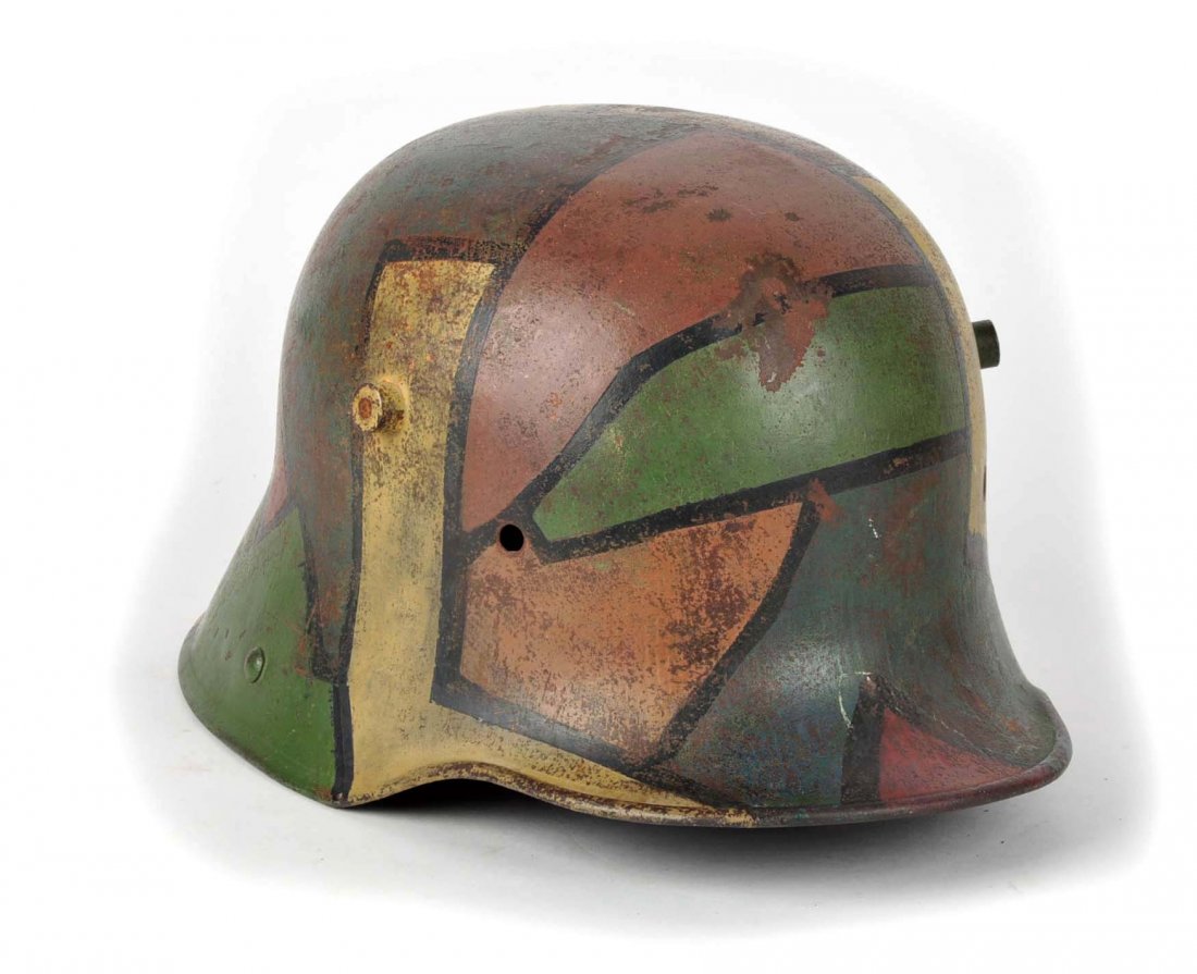 WWI German Helmet.: 12 - 1/2” L. Lot contains an original German WWI helmet shell, however camouflage paint has been applied post war.