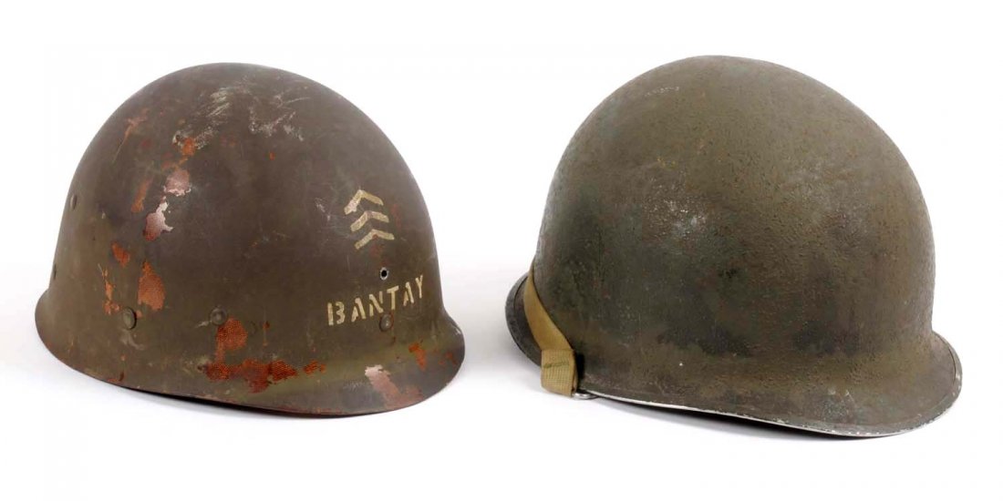 US WWII Helmet with Liner.: Lot contains an original WWII swivel bail US helmet. Liner is named to a Sgt. Bantay. Second Ranger Battalion markings have been added post war.