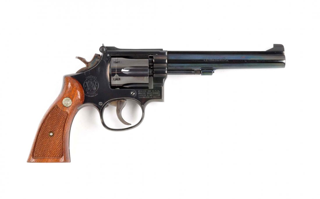 (M) S&W Model 48-4 Double Action Revolver.: Manufacturer: S&W Model: 48-4 Serial No. 92K9405 Caliber: .22 Winchester Magnum rimfire Barrel Length: 5-7/8” FFL Status: Modern This revolver is referred to as the K-22 Masterpiece Magnum Rimfire. 