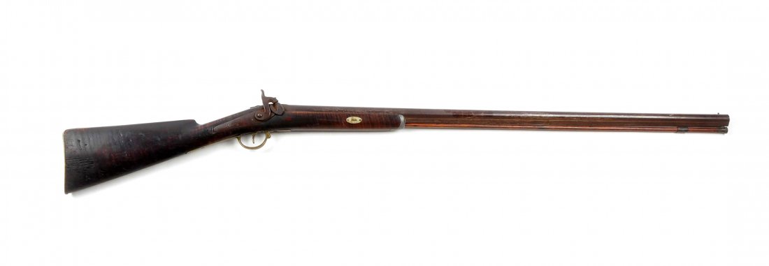 (A) Percussion Tiger Maple Half Stock Fowler.: Caliber: 20 bore Barrel Length: 36-1/2” FFL Status: Antique Round 20 bore smooth bore barrel marked with English proof marks near breech. Unmarked back action percussion lock. Unique brass trigger, 