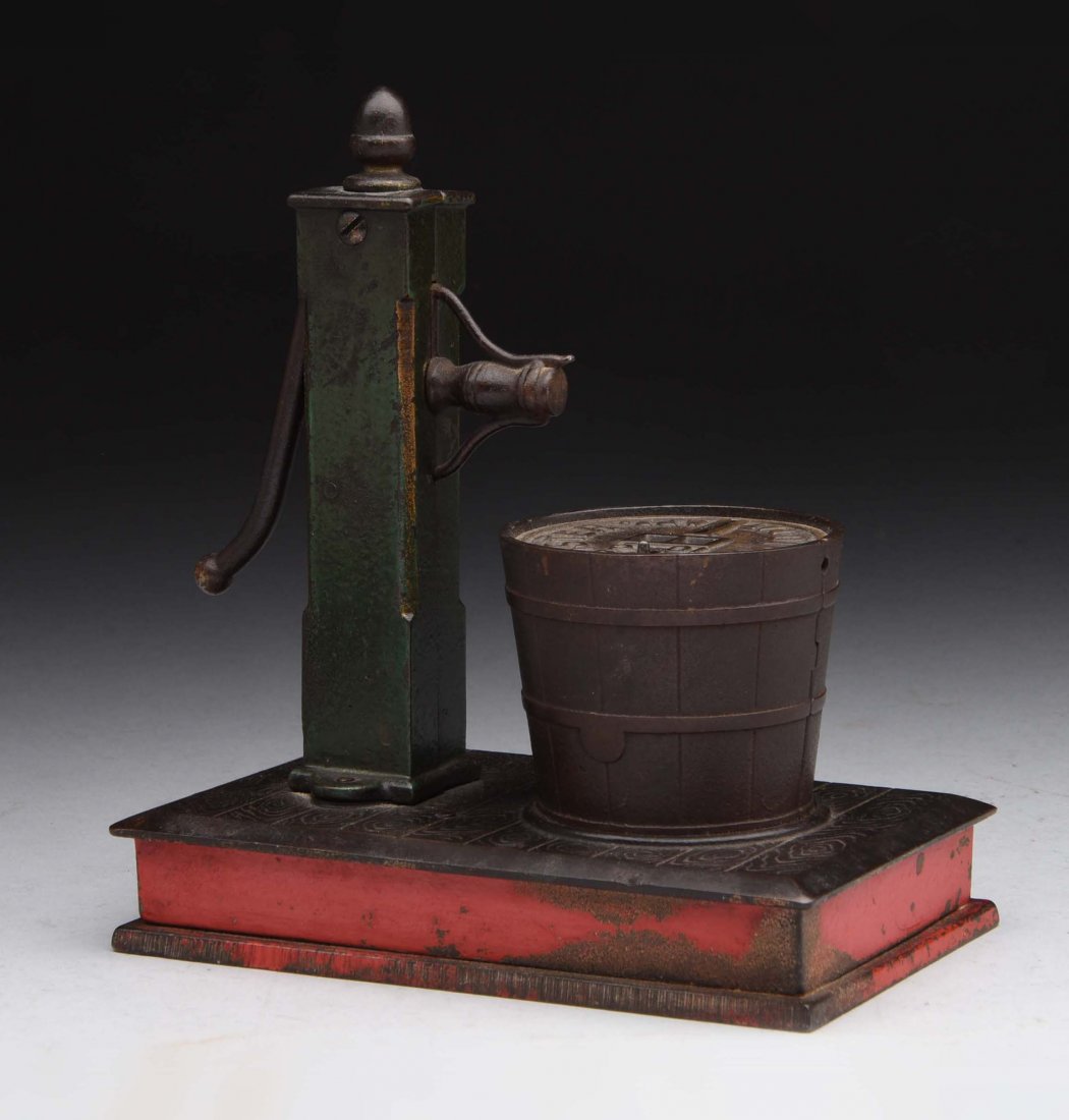 Cast Iron Pump & Bucket Mechanical Bank. (1 of 2)