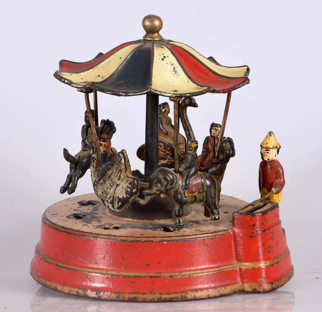 Kyser & Rex Merry Go Round Cast Iron Mechanical Bank. (1 of 2)