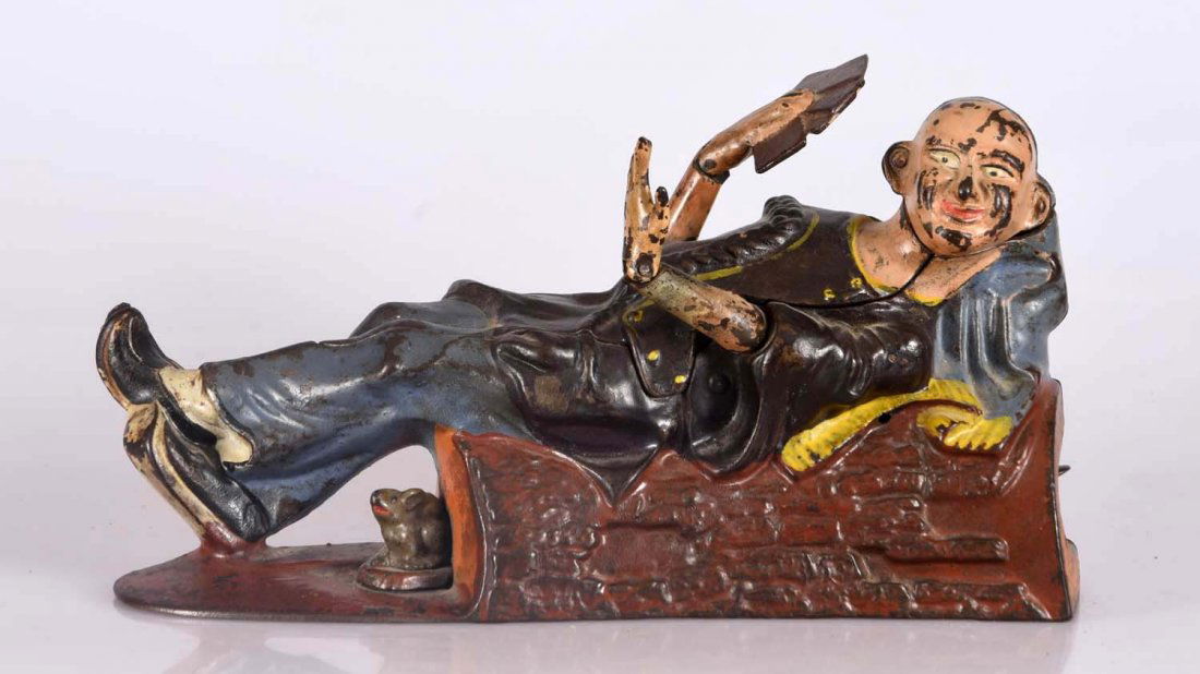 J.&E. Stevens Reclining China Man C.I. Mechanical Bank. (1 of 3)