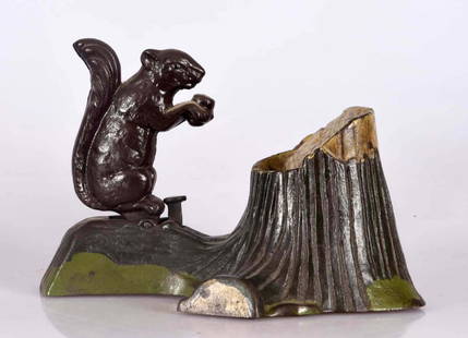 Mechanical Novelty Works Squirrel & Tree Stump Cast: Place a coin on the acorn and press the lever. The squirrel moves forward and drops the coin in the stump. (JY). Very Good