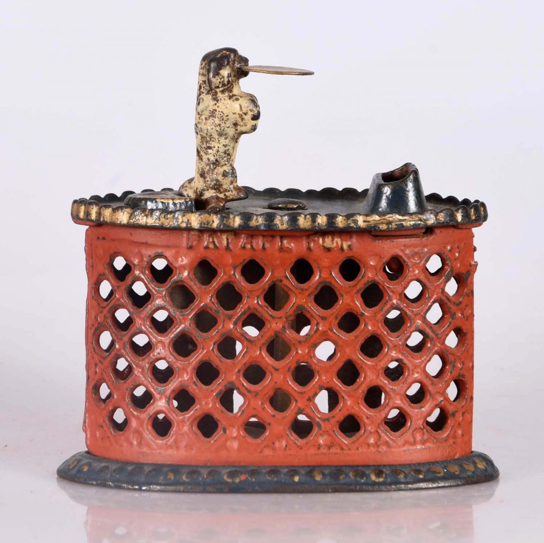 Kyser & Rex Dog Tray Cast Iron Mech. Bank.: Place a coin on the tray. The weight of the coin causes the dog to lean forward and deposit the coin into the bank. Red and blue repainted. Original paint to dog. (JY).
