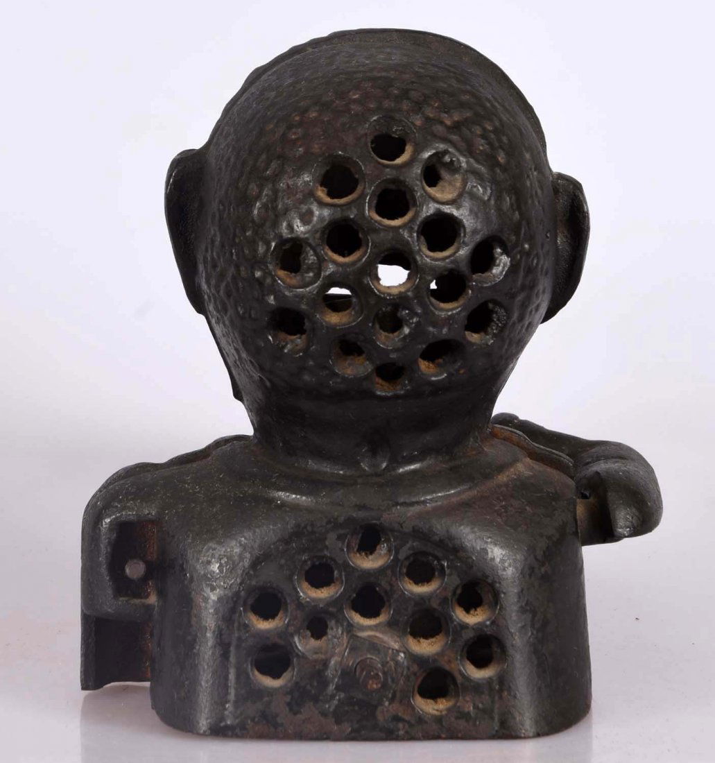 Cast Iron Jolly "N" Mech. Bank.: Bank is bolted together and painted all black with painted lips and teeth. Fixed eyes. Fit not tight. (JY).