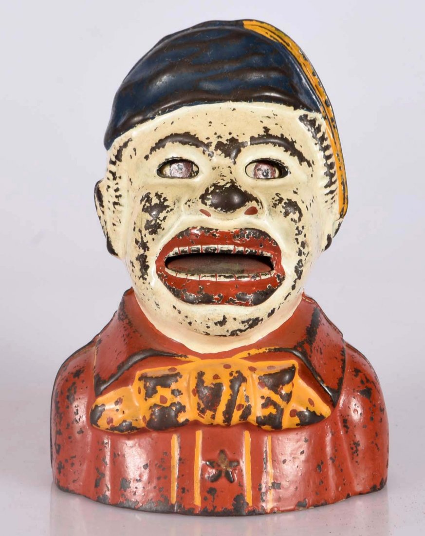 Kyser & Rex Hindu Cast Iron Mech. Bank.: By pressing the lever in the back, the eyes roll up and the tongue is thrust out for a coin. Place coin on tongue and release to deposit the coin. Repainted. (JY). Excellent