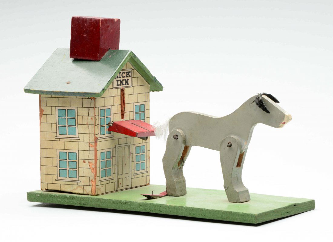 Cast Iron Mechanical Kick Inn Bank. (1 of 2)