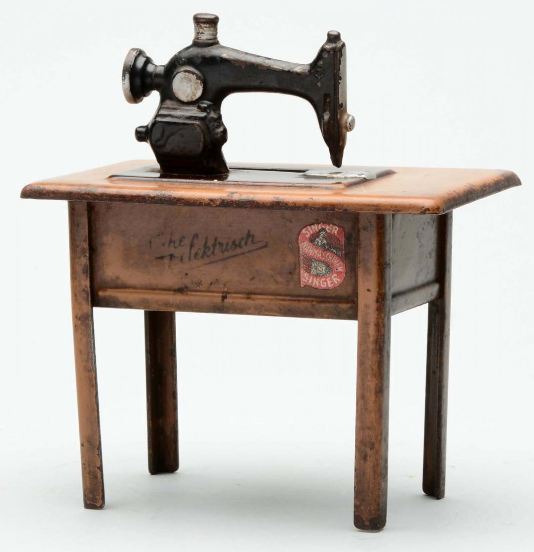 German Tin & Cast Iron Sewing Machine Still Bank. (1 of 2)