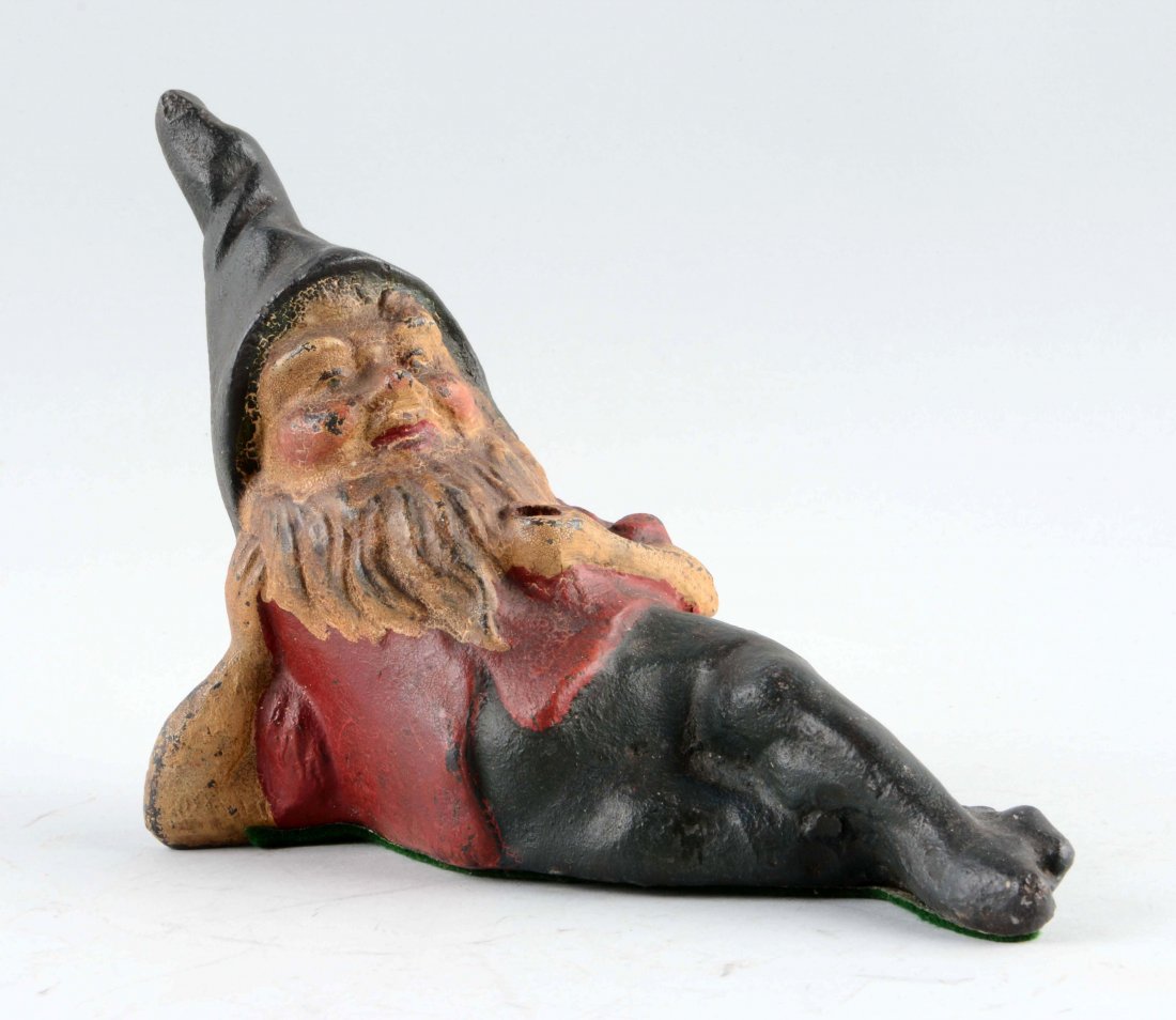 Cast Iron Reclining Gnome Doorstop. (1 of 2)