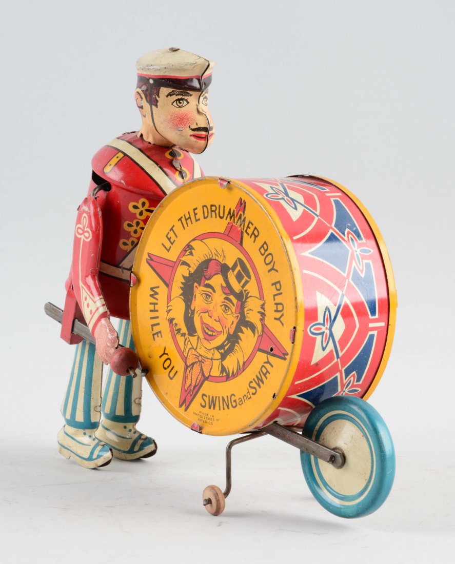 Marx Tin Litho Wind-Up George The Drummer Toy.: Nice lithography and good action. When in operation George bangs the drum with the mallet in his right hand. Drum says "Let the Drummer Boy play while you swing and sway". Some general scratching and