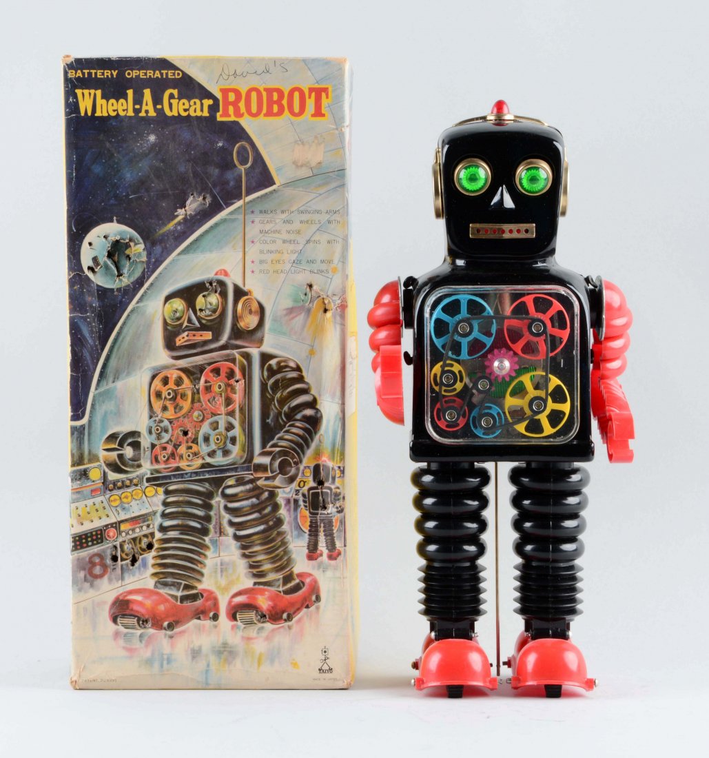 Japanese Tin Litho Battery Operated Wheel-A-Gear Robot. (1 of 2)