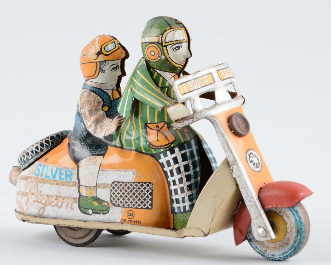 Japanese Tin Litho Friction Marusan "Silver Pigeon" (1 of 2)