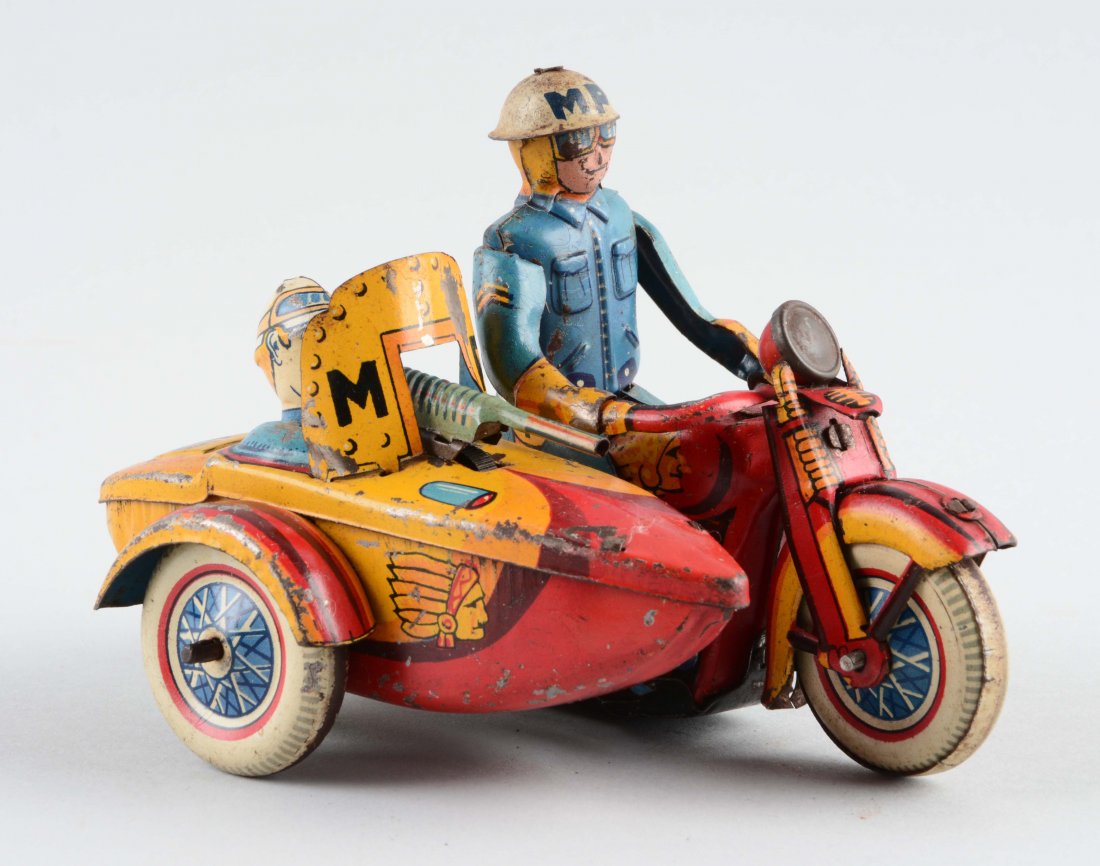 Japanese Tin Litho Wind Up MP Motorcycle w/ Sidecar: Marked "MP" on the driver's helmet and side car wind screen. Side car rider is firing machine gun. Indian w/ headdress lithographed on side car and left side gas tank of motorcycle. Nice colorful lith