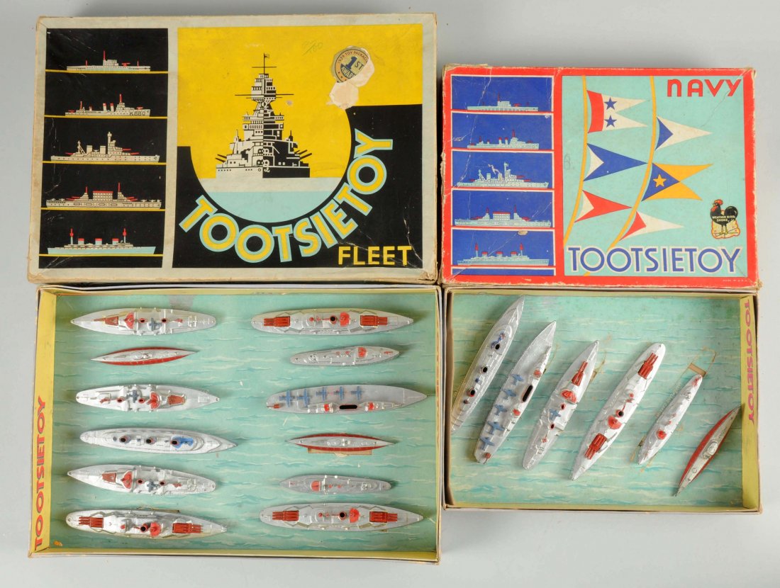 Lot Of 2: Tootsietoy Ship Boxed Sets.: First set is the No. 5750 Navy Ship Set. Includes: Aircraft Carrier, Battleship, Cruiser, Troops Ship, Destroyer and Submarine. Some have a few minor paint chips. Original box with insert has some cor