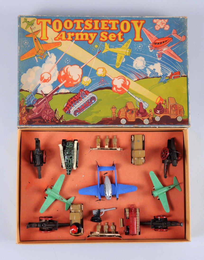 Tootsietoy No. 5220 Army Boxed Set.: Set includes: Waco airplane, both props broken, some scratches and paint chips, in very good condition. Two Army fighter planes, both in like new condition. Four Cannons, complete and in like new cond