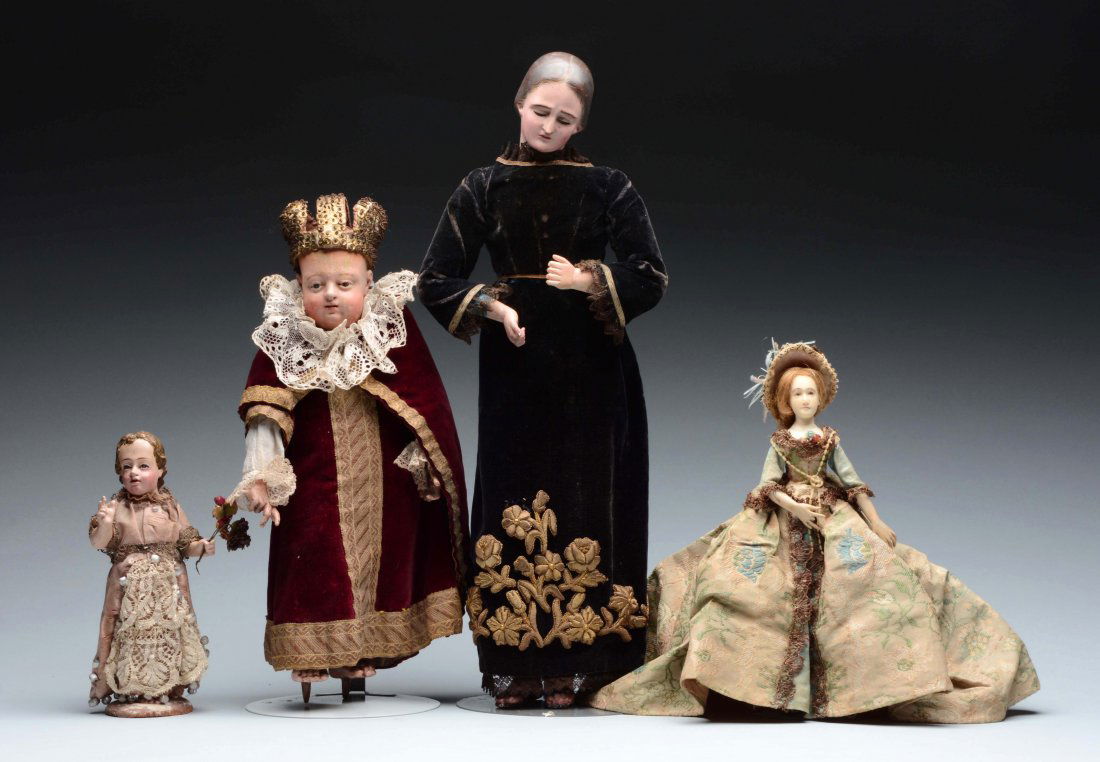 Lot of 4: Wooden & Wax Creche Related Pieces.: The largest figures is that of a man with narrow cut slit eyes, head turned slightly to the right, on a stationary wooden body with carved and painted sandals on the bare feet. He wears a velvet ankle