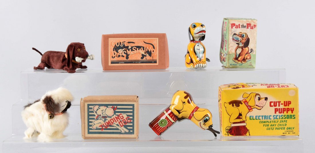 Lot Of 4: Tin Wind-Up & Battery-Operated Toys.: Includes a T.P.S. Made in Japan toy called Pat the Pup in working condition with some minor scratches and original box; battery-operated Cut-Up Pup with a few minor scratches and original box; wind-up