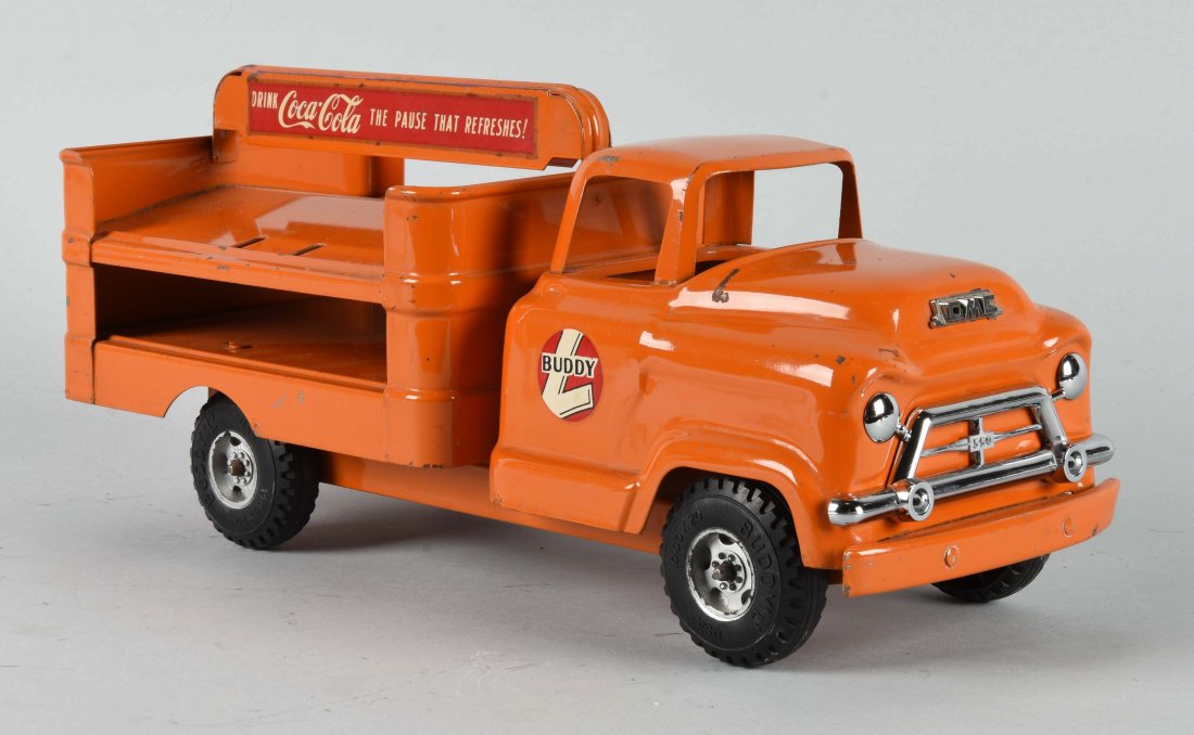 Pressed Steel Buddy L GMC Coca-Cola Truck.: Circa mid 1950’s. GMC front truck, not the normal front for a Coca-Cola truck. Hand truck and cases are not present. The plastic grill is in very good condition, some scratches and paint chips. (Ver