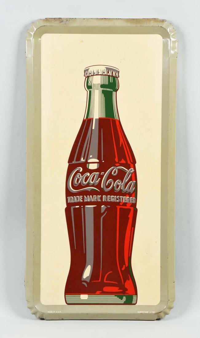 Advertising Coca-Cola Sign with Bottle.: This lot is of a Coca-Cola tin advertising sign with a bottle of Coca-Cola as the center piece. Slight discoloration, minor wear, dents and rust present. Very Good 36-1/2'' L.