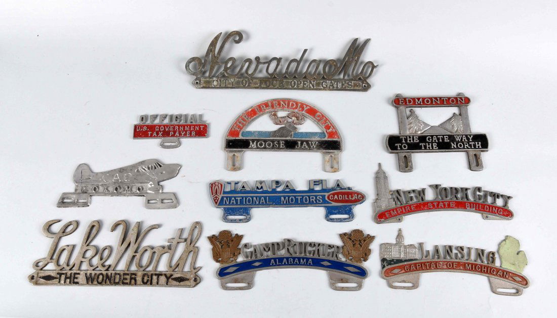 Lot of 10: Cast Aluminum License Plate Attachments. (1 of 1)