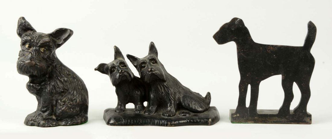 Lot of 3: Cast Iron Assorted Dog Doorstops.: Wilton, Singer Sewing Machine, etc. Includes Twin Scotties; Terrier Silhouette; Sad Pup. (Very Good). Largest: 8" T.