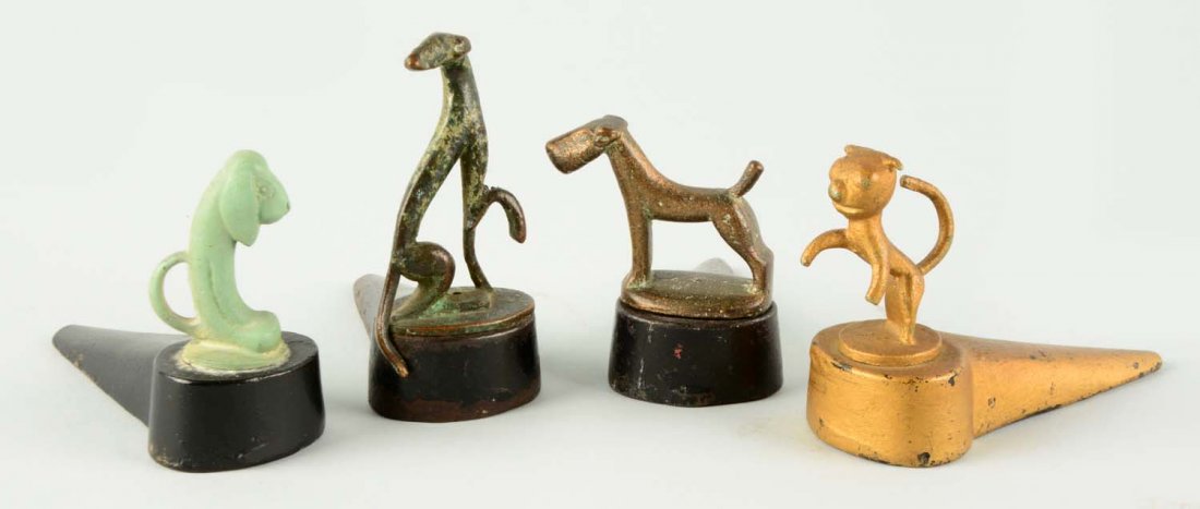 Lot of 4: Cast Iron Assorted Doorstops. (1 of 1)