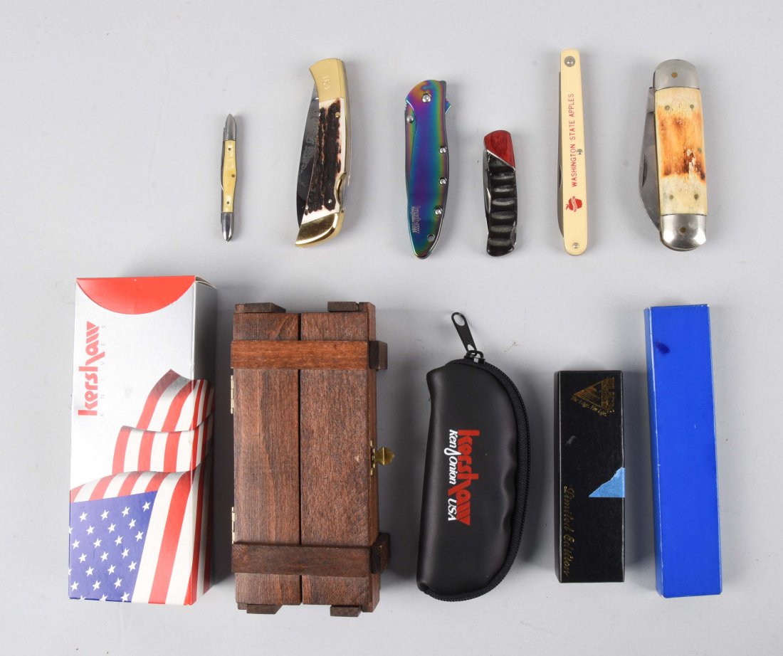 Lot Of 6: Folding Knives by Buck Custom and Others.: 1) Kershaw 4" 1 blade tactical lock back in all metal rainbow finish, correct carrying pouch and factory box, contemporary, near mint condition. 2) Buck custom U.S.A. 2-3/4" 1 blade lock back, handled