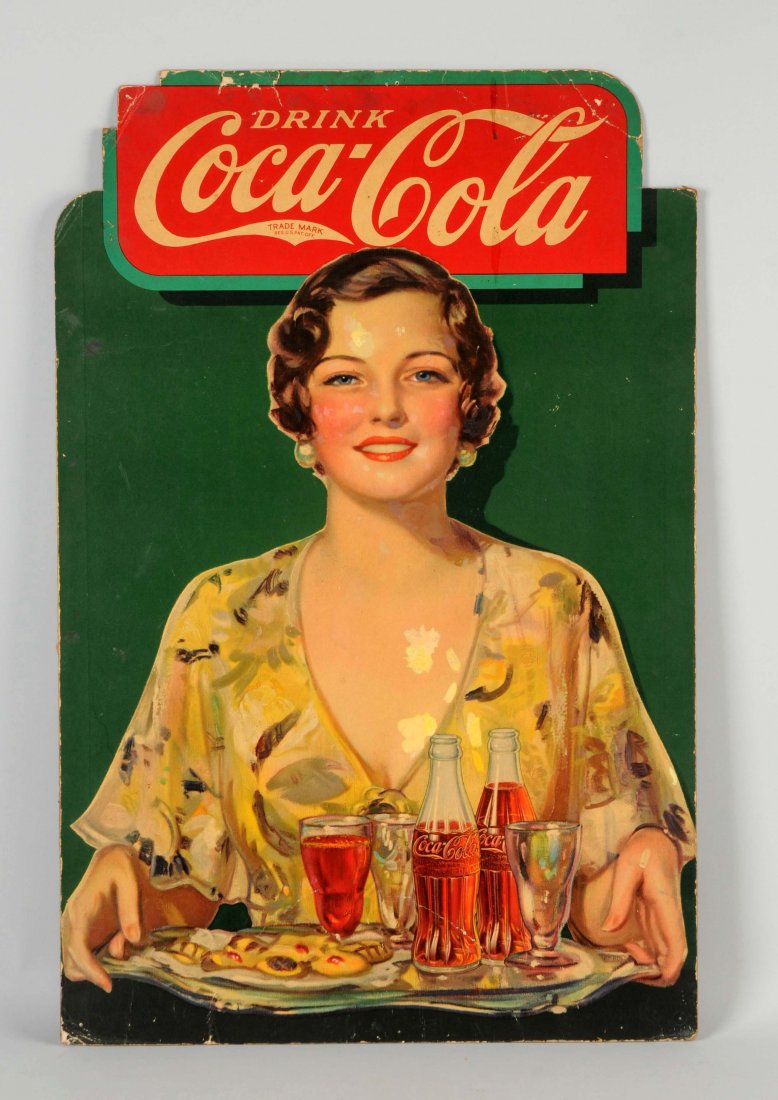 Coca-Cola Cardboard Diecut Advertising Sign.: Shows a woman holding a serving tray with hor d'ourves and bottles of Coca-Cola. There is some moderate damage to upper section of the sign, fold marks, paper loss and soiling. There are also some are