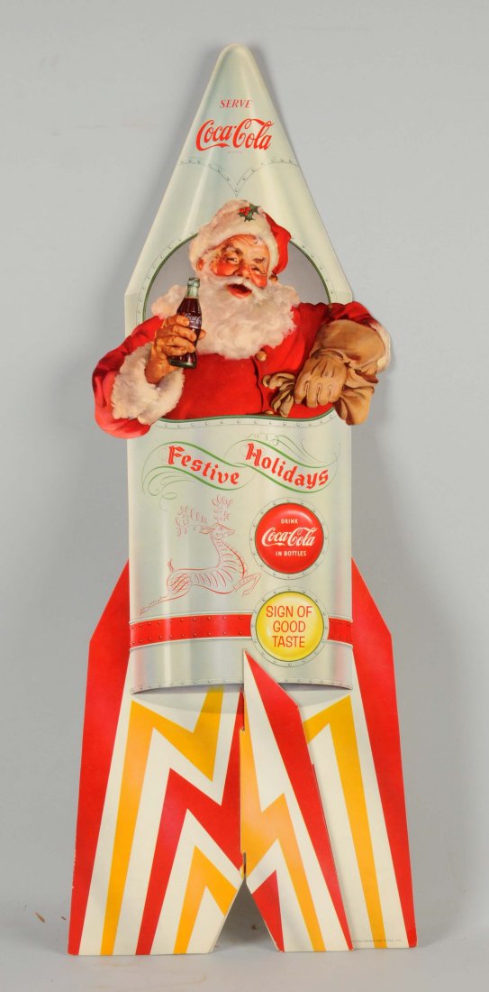 1950 Coca-Cola Santa Claus Diecut Sign.: This is a diecut sign shows Santa sitting inside a rocket. The colors are very strong and vibrant. One bent right corner with the rest of the sign in fantastic condition. (Excellent). 33 - 1/2" x 11".