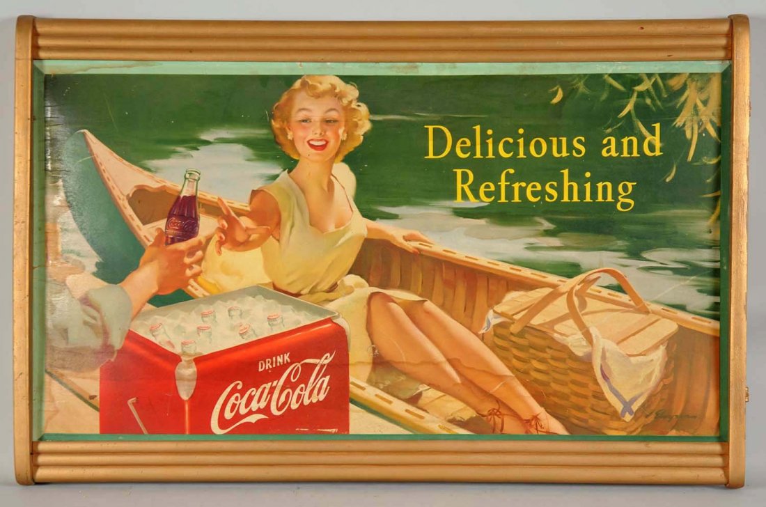 Coca-Cola “Delicious and Refreshing” Cardboard: Sign retains the original Kay Displays wooden frame. The sign has some water damage, warping, closed tears and paper lifting. (Good). 37" x 24".