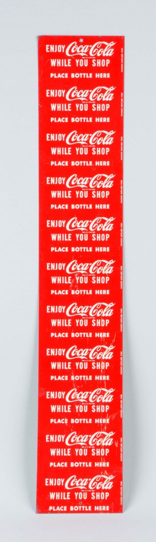 Coca-Cola Tin Sign Sheet.: Uncut sheet of signs that read "Enjoy Coca-Cola while you shop" and a space where a bottle is placed. There are some punched holes and scrapes. (Very Good). 27-1/2'' x 5''.