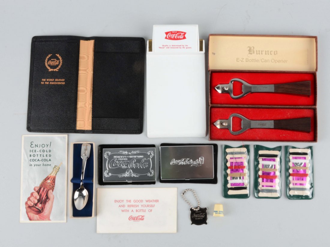 Large Lot Of Coca-Cola Advertising Pieces.: Includes a note pad, thimble, openers, spoon and other items. (Very Good). Largest : 8" L.