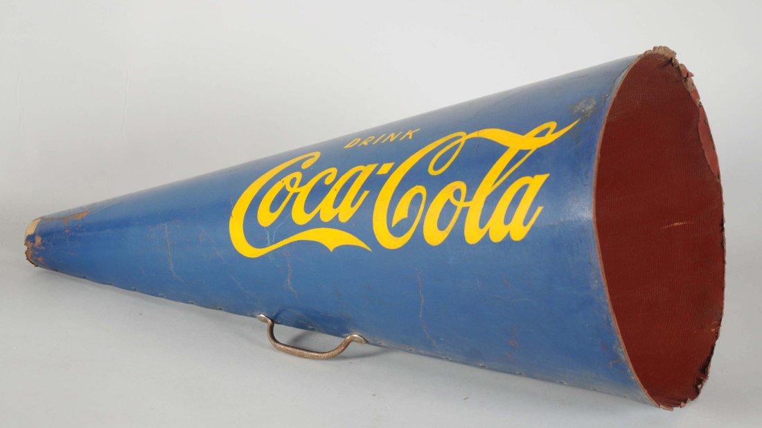 Lot of Coca-Cola Megaphone.: There is wear to both edges, cardboard loss and soiling. Also includes (Good - Very Good). Largest : 29" T.
