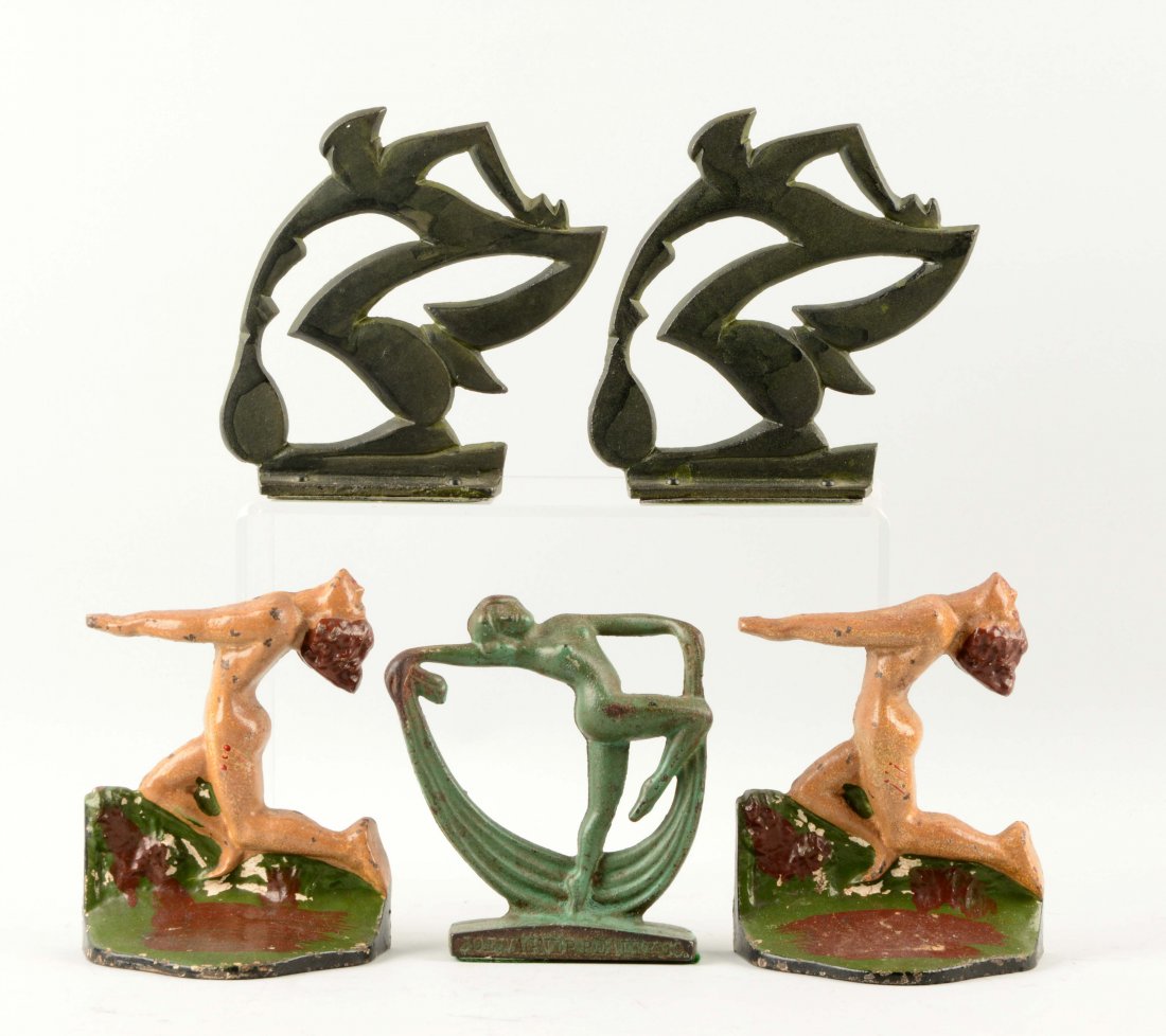 Lot of 2 Pairs, 1 Single: Cast Iron Assorted Bookends&: Includes deco Lady, â€œJoe Wagner Realty Co.â€, wedge doorstop; Nude Lady; and deco Tennis Player. (Very Good). Largest: 5-3/4'' T.