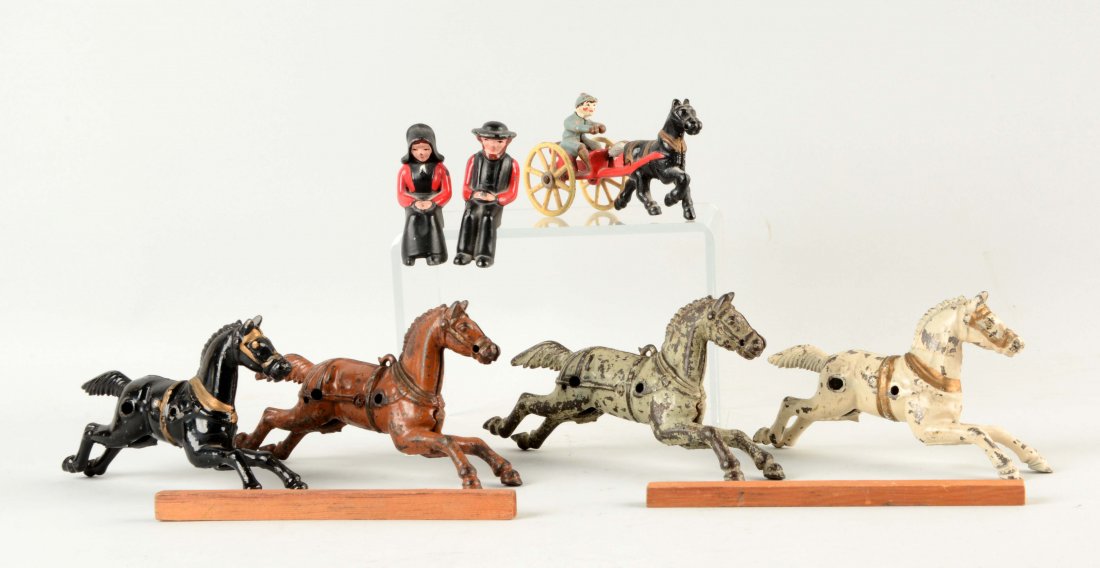 Lot of Vintage Cast Iron Horses & Amish Couple.: Includes four vintage horses, a contemporary sulky and contemporary Amish couple. CORRECTION: Does not include the two wooden logs & the Amish figures. (Very Good). Largest : 7" x 1 -1/2".
