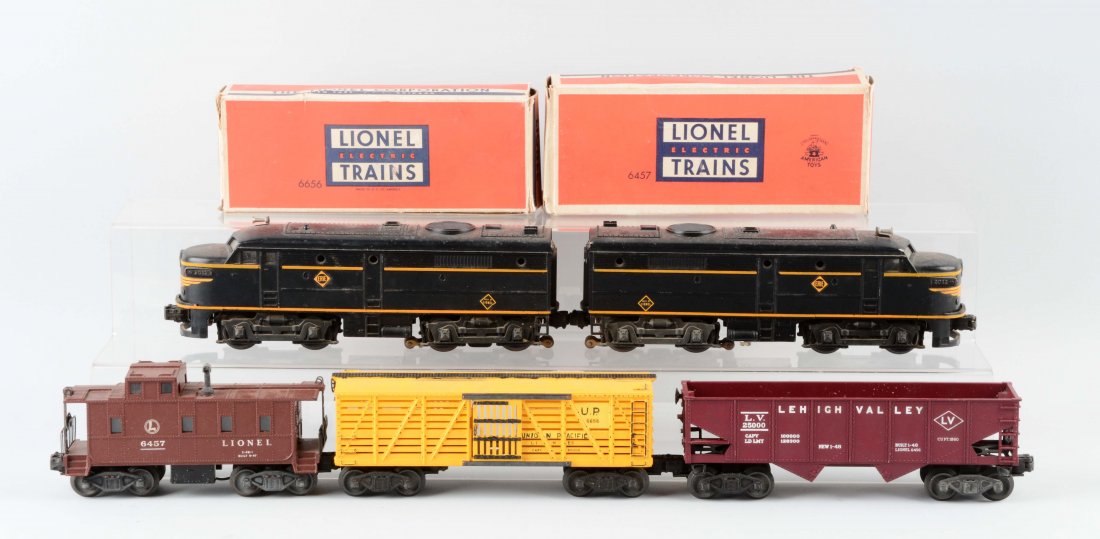 Lot Of 5: Lionel Erie Alcos and Freight Cars.: Lot includes: Erie Alcos - complete and all original, clean battery boxes, would clean to excellent condition. No. 6656 Cattle Car - clean trucks and frame, some repainting, in good condition. No. 645