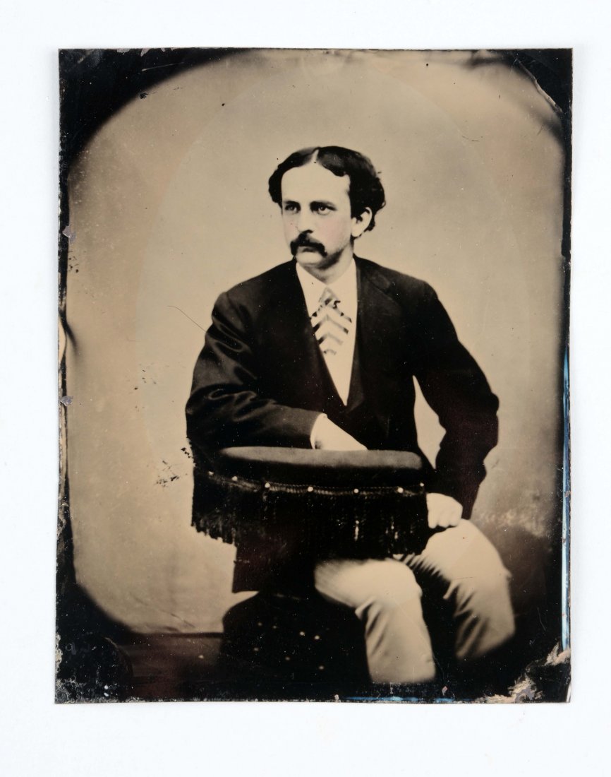 Full Plate Tin.: Thought to be John Wilkes Booth posing with hair parted in the middle for a promotional picture. (Excellent). 7-1/2'' x 6''.