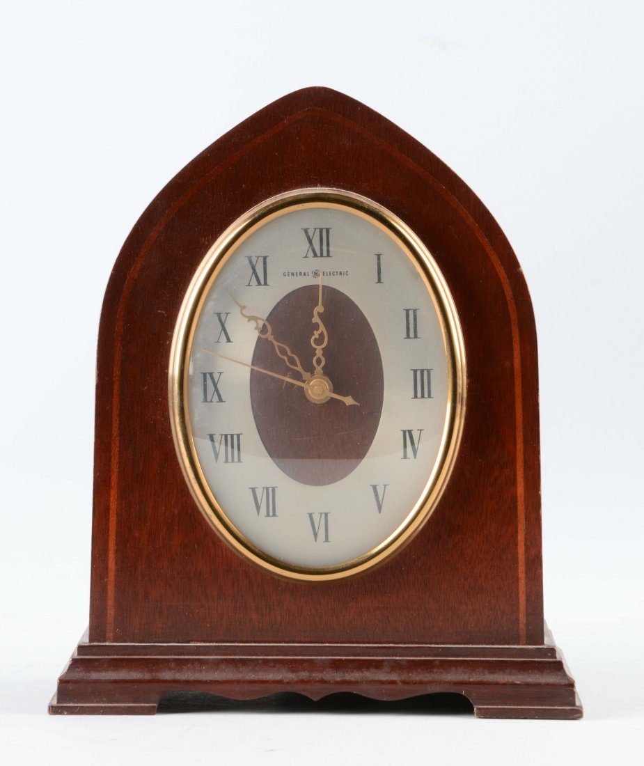 General Electric Wooden Mantel Clock.: Circa 1950's. Model 26 West Minster chime. Minor wear to the wooden frame. (Very Good). 10" x 8 -1/4".