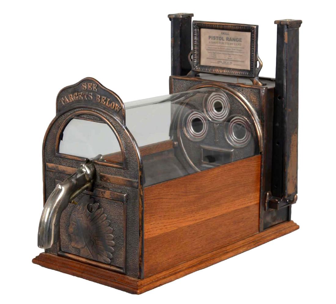 1¢ Charles Fey & Sons Pistol Range Shooting Game: This entertaining countertop game was manufactured in 1920 by Charles Fey & Sons. The player inserts a penny into the pistol and then shoots that penny into one of three bullseye targets. Getting a co