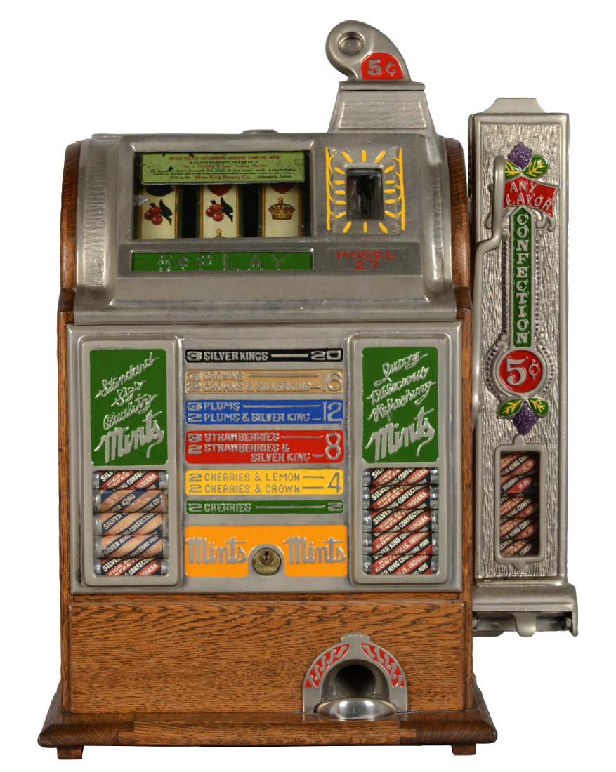 **Rare 5¢ Silver King Model 27 Slot Machine: This three reel machine with nice original tin reel strips and nickel plated castings has been repainted. In working condition, plays well and vends. Vendor, however, is a possible replacement. Includ