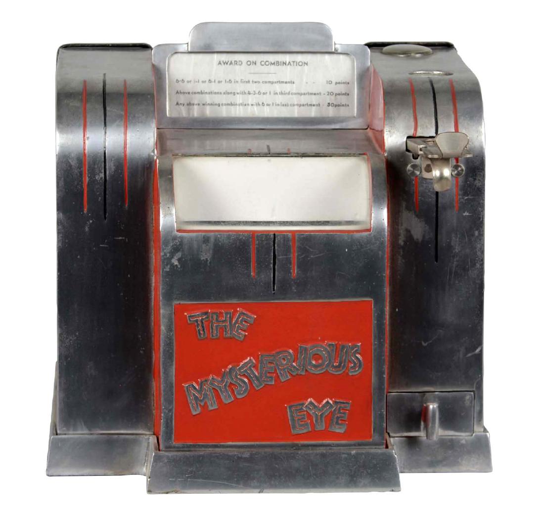 5¢ Western Equipment & Supply The Mysterious Eye Dice: Silver and red Art Deco style cabinet with four dice. The player calculates their score based upon the numbers on the dice. Circa 1933. One key is provided. Also included is the very rare, original me