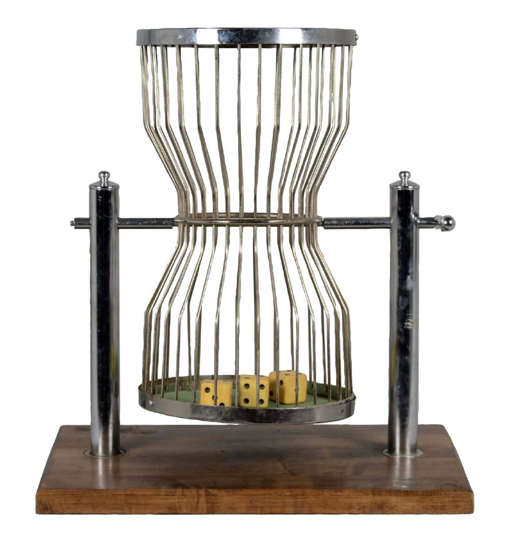 Tabletop Chuck-A-Luck Dice Cage: This large birdcage is mounted to a wood base platform. Includes three large dice. Shows only minor wear to the metal. (Very Good). 11" x 17-1/2" x 20".